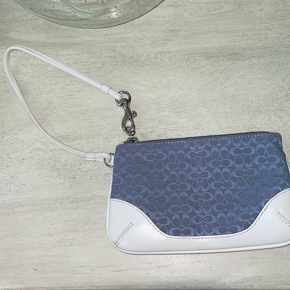 COACH signature wristlet in light blue and white leather.